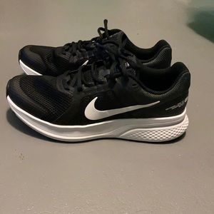 Black Nike running shoes